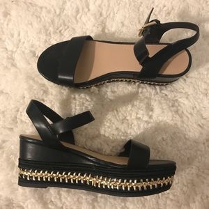 ALDO BLACK AND GOLD WEDGES